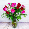 Bouquet of pink and red roses in a clear glass vase