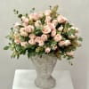 Pink rose bouquet in a sculpted gray vase