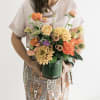 Lovey mix of bright and earthy tones of premium blooms. This is