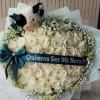 Bouquet of white roses with a plush cow and a proposal ribbon