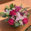 Pink and white mixed bouquet in a green vase