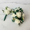 Carnation boutonniere and corsage set accented with wax flower and greenery. The