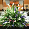 PODIUM ARRANGEMENT 85 BY TWIN TOWERS FLORIST

    As Shown