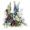 This vehemently designed red, white, and blue bouquet honorably showcases the cremation