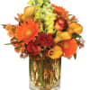 Bring seasonal color indoors with this lavish array of fall flowers! Our