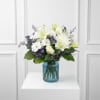 Handcrafted with care, the Quiet Comfort arrangement creates a serene and comforting