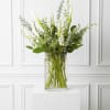 Express your deepest sympathy with this elegant funeral arrangement that speaks to
