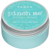 A turquoise jar labeled "pinch me therapy dough" with a silver lid