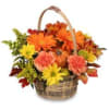 Basket of orange, yellow, and pink flowers with a handle