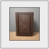A worn brown hardcover book standing upright