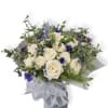 A graceful June-inspired bouquet of white roses, soft blue blooms, and fresh