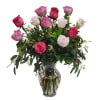Bouquet of pink and white roses in a clear glass vase