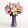  bouquet of purple roses; lavender stock, Peruvian lilies (alstroemerias), and daisies;