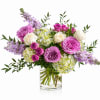 A soft, garden-inspired arrangement in a dreamy palette of blush, lavender, and