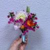 Small hand-tied bouquet with pink, white, and orange flowers