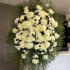 White floral standing spray with roses and chrysanthemums