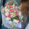 Pink and white mixed bouquet wrapped in translucent paper