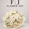 Bouquet of cream roses with eucalyptus accents and ribbon ties