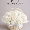 A timeless arrangement of white roses and delicate hydrangeas, beautifully presented in