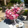 Pink and white rose bouquet in a pedestal vase