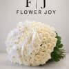 A graceful arrangement of ivory roses and delicate white orchids, finished with