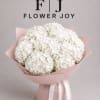 A lush arrangement of elegant white hydrangeas, beautifully wrapped in soft blush