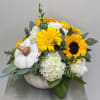 White pumpkin arrangement with yellow sunflowers and white hydrangeas
