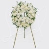 White floral wreath on a standing easel