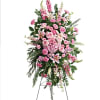 Tall pink floral standing spray on an easel