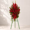This rich, radiant spray of red roses, gladioli and other popular red