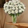 Bouquet of white roses in a clear glass vase