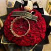 Large red rose bouquet with a plush cow and a "TO MY KING" ribbon