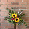 Sunflower and pink rose arrangement in a tall vase