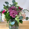 The Natural Beauty flower arrangement is a stunning mix of lavender roses