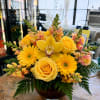 A sunny burst of yellow anchored by a single yellow orchid creates