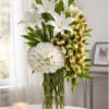 The Graceful Tribute Sympathy Vase is a sophisticated silk funeral arrangement featuring