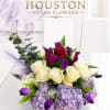 A striking blend of jewel tones and soft pastels, this flower arrangement