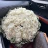 A romantic composition of 50 Roses ,artfully gathered into a perfect round