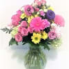 Miniature roses,daisies,and assorted bright flowers of designers choice 