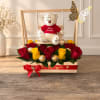 Red and yellow roses with a teddy bear in a wooden gift box