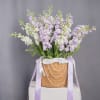 Inspired by regal romance, this delicate lavender arrangement evokes elegance, femininity, and