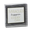 Decorative sign with the words "Miracles happen every day"