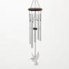 Silver wind chime with a hummingbird ornament hanging from a dark top frame