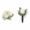 White rose bouquet and matching boutonniere with green leaves