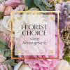 Pastel pink and white mixed flowers with a label reading Florist Choice Vase Arrangement