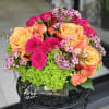 Bright mixed bouquet with sunflowers, peach/blush roses and pale green hydrangeas with