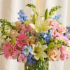 Especially for mom. This dream garden arrangement made with delphinium , roses