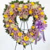 A 24" heart shaped sympathy standing arrangement designed to express gentle remembrance