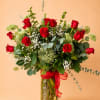 24 Premium Freedom roses imported from Ecuador, with greens and fillers. Built