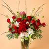 Beautiful one-sided flower arrangement with red mix blooms. This arrangement is built
